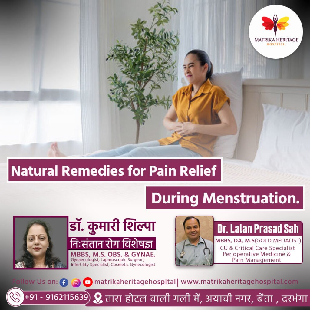 Woman sitting on bed holding her lower abdomen with a hot water bag and herbal tea nearby